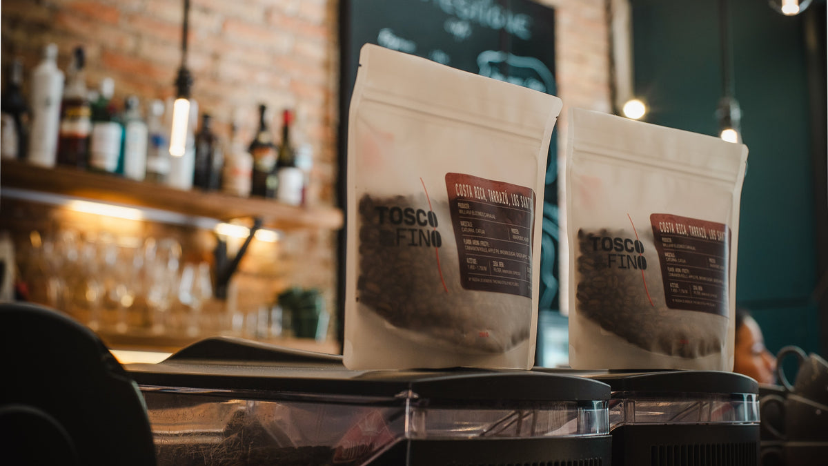 Tosco Fino specialty coffee bags on the grinders at the Barcelona café